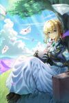  1girl absurdres blonde_hair blue_eyes blue_jacket boots braid braided_bun brooch brown_boots closed_mouth field flower flower_field gem green_gem hair_between_eyes hair_bun highres holding holding_letter jacket jewelry letter long_skirt mechanical_arms sitting skirt smile solo soy_chicken violet_evergarden violet_evergarden_(series) white_skirt 