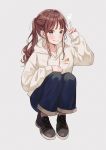  1girl black_footwear blue_pants blush brown_hair denim english_text green_eyes hanako151 hand_up highres hood hoodie jeans long_sleeves original pants ponytail shoes signature simple_background smile sneakers solo squatting v white_hoodie 