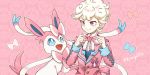 1boy bangs bede_(pokemon) blonde_hair blush bow buttons character_name closed_mouth commentary fangs gen_6_pokemon happy jacket long_sleeves looking_down open_mouth pink_background pink_jacket pokemon pokemon_(creature) pokemon_(game) pokemon_swsh purple_eyes sasairebun smile sylveon tongue 