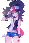  1girl baseball_cap black_vest black_wristband brown_hair closed_mouth collarbone commentary cowboy_shot denim denim_shorts fingernails green_eyes hand_on_headwear hand_up hat highres hilda_(pokemon) holding holding_poke_ball long_hair ohds101 poke_ball poke_ball_(basic) pokemon pokemon_(game) pokemon_bw shirt short_shorts shorts sidelocks sleeveless sleeveless_shirt solo vest white_shirt wristband 