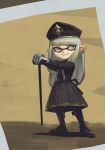  1girl absurdres bangs black_dress black_footwear black_headwear boots closed_mouth domino_mask dress full_body gogalking grey_hair grey_neckwear grey_ribbon hat highres holding holding_stick inkling mask military_hat neck_ribbon original pointy_ears ribbon smile solo splatoon_(series) splatoon_2 standing stick swept_bangs uniform_girl_(gogalking) walking_stick yellow_eyes 