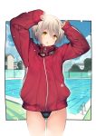  1girl :o absurdres arms_up bangs black_swimsuit blush border commentary_request cowboy_shot day eyebrows_visible_through_hair goggles goggles_around_neck hair_between_eyes highres jacket long_sleeves looking_at_viewer open_mouth original outdoors outside_border pool red_jacket short_hair silver_hair sleeves_past_wrists solo swimsuit swimsuit_under_clothes thighs track_jacket twinpoo water white_border yellow_eyes 
