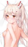  1girl absurdres ayanami_(azur_lane) azur_lane back bed_sheet blonde_hair blush breasts close-up closed_mouth dakimakura from_above headgear highres long_hair lying medium_breasts nicx nude on_stomach ponytail upper_body yellow_eyes 
