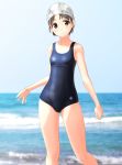  1girl absurdres beach blue_sky blue_swimsuit blurry breasts brown_eyes brown_hair cloud commentary_request cowboy_shot day depth_of_field highres horizon looking_at_viewer new_school_swimsuit ocean original outdoors school_swimsuit short_hair sky small_breasts solo swim_cap swimsuit takafumi waves 