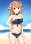  1girl bikini black_choker blue_bikini blue_sky breasts brown_eyes choker cleavage cloud contrapposto cowboy_shot driftkingtw hair_ornament hand_on_hip horizon johnston_(kantai_collection) kantai_collection light_brown_hair long_hair looking_at_viewer medium_breasts navel ocean sky solo strapless strapless_bikini swimsuit two_side_up 