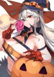  1girl breasts candy cleavage food gloves halloween hat highres holding holding_candy holding_food holding_lollipop jack-o&#039;-lantern large_breasts lollipop long_hair looking_at_viewer navel original pumpkin red_eyes red_gloves silver_hair smile solo witch_hat yamanokami_eaka 