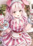  1girl animal_ears apron bangs blurry blurry_background blush bow breasts brown_eyes bunny bunny_ears cake candy cherry cleavage commentary_request cup dress fake_animal_ears flower food frilled_dress frills fruit heart heart_print highres holding holding_tray large_breasts long_hair looking_at_viewer maid maid_headdress open_mouth original pink_flower pink_theme red_bow red_flower restaurant rose saya_(mychristian2) strawberry striped striped_dress sweets teacup teapot tray waffle waist_apron wavy_hair 