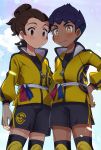  2boys black_shorts blush brown_eyes brown_hair chokutsuu_(menino) closed_mouth cloud commentary_request dark_skin dark_skinned_male hand_on_hip highres hop_(pokemon) jacket knee_pads male_focus master_dojo_uniform multiple_boys pokemon pokemon_(game) pokemon_swsh purple_hair sash shirt short_hair shorts side_slit side_slit_shorts sky smile victor_(pokemon) yellow_eyes yellow_jacket zipper_pull_tab 