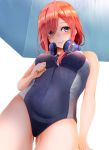  1girl bare_shoulders blue_eyes blush breasts brown_hair competition_swimsuit eyebrows_visible_through_hair from_below go-toubun_no_hanayome hair_over_one_eye headphones headphones_around_neck highres kiko_(okuwae) large_breasts long_hair looking_at_viewer nakano_miku one-piece_swimsuit solo swimsuit 