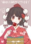  1girl absurdres black_hair candy_apple floral_print food happy highres japanese_clothes kimono linda_18 looking_at_viewer no_wings pom_pom_(clothes) red_eyes red_kimono shameimaru_aya smile touhou wide_sleeves 