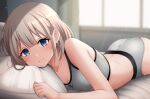  1girl ass bed_sheet blue_eyes blush breasts commentary frozenpile grey_hair grey_panties grey_sports_bra idolmaster idolmaster_shiny_colors indoors looking_at_viewer lying on_stomach panties pillow serizawa_asahi small_breasts smile solo sports_bra sunlight underwear underwear_only window 