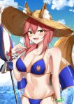  1girl absurdres animal_ear_fluff animal_ears beach_umbrella bikini blue_bikini blush breasts cleavage collarbone commentary_request ears_through_headwear eyebrows_visible_through_hair fangs fate/grand_order fate_(series) fox_ears fox_girl fox_tail groin hat highres innertube large_breasts looking_at_viewer milltyan navel ocean open_mouth outdoors pink_hair side-tie_bikini skin_fangs solo straw_hat swimsuit tail tamamo_(fate)_(all) tamamo_no_mae_(swimsuit_lancer)_(fate) umbrella yellow_eyes 