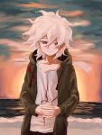  1boy bangs cloud coat danganronpa green_coat grey_eyes hair_between_eyes hands_clasped highres hood hood_down komaeda_nagito long_sleeves male_focus ocean outdoors own_hands_together renshu_usodayo shirt sky smile solo sunset super_danganronpa_2 water white_hair white_shirt 