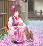  1girl absurdres animal animal_ear_fluff animal_ears bamboo_fence black_footwear bow brown_hair cat cat_ears closed_mouth commentary_request fence floral_print flower gradient gradient_kimono hair_bow hair_bun hair_flower hair_ornament highres iroha_(iroha_matsurika) japanese_clothes kimono long_hair long_sleeves obi original petals pink_flower pink_kimono print_kimono purple_bow red_bow sash sleeves_past_wrists smile solo squatting tabi white_kimono white_legwear wide_sleeves zouri 