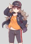  1girl aston_martin bangs baseball_cap black_jacket black_shorts blunt_bangs brown_hair closed_mouth clothes_writing collarbone cowboy_shot hand_in_pocket hand_on_headwear hat honda idolmaster idolmaster_cinderella_girls jacket kamiya_nao logo long_hair long_sleeves looking_at_viewer midriff_peek one_eye_closed open_clothes open_jacket orange_shirt pinky_out red_bull red_eyes satomura_kyou shirt shorts simple_background smile solo thick_eyebrows wavy_hair 