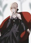  1girl artoria_pendragon_(all) bangs black_bow black_dress black_sleeves blonde_hair bow braid braided_bun breasts cleavage closed_mouth collarbone criss-cross_halter dress eyebrows_visible_through_hair fate/stay_night fate_(series) hair_bow halterneck harukaze_(rori_0826) long_dress long_sleeves looking_at_viewer saber_alter short_hair sitting sleeveless sleeveless_dress small_breasts solo yellow_eyes 