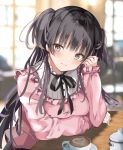  1girl :3 arm_rest arm_under_breasts bangs black_hair black_neckwear black_ribbon blunt_bangs blurry blurry_background blush breasts brown_eyes cappuccino_(drink) closed_mouth commentary_request cup eyebrows_visible_through_hair frills hand_in_hair heart idolmaster idolmaster_shiny_colors indoors long_hair long_sleeves looking_at_viewer mayuzumi_fuyuko medium_breasts neck_ribbon pink_shirt pon_(ponidrop) ribbon saucer shirt sitting sleeves_past_wrists smile solo sugar_bowl table two_side_up upper_body window 