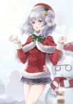  1girl bell blue_eyes capelet commentary_request cowboy_shot fur-trimmed_capelet fur_trim grey_eyes grey_skirt hat hatomaru_(hatomaru56) highres holding_snowball kantai_collection kashima_(kantai_collection) pleated_skirt red_capelet red_headwear red_sweater santa_hat silver_hair skirt snowball snowman solo standing sweater the_roma-like_snowman twintails wavy_hair 