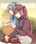  2girls alternate_costume asagumo_(kantai_collection) beige_skirt black_legwear black_sweater braid brown_eyes brown_hair christmas_dress commentary_request cup green_hairband green_sweater grey_eyes hair_ribbon hairband heart heart_pillow kantai_collection long_hair mug multiple_girls pantyhose pillow pleated_skirt ribbon sagamiso sidelocks silver_hair single_braid sitting skirt smile sweater turtleneck twintails wariza wavy_hair yamagumo_(kantai_collection) 