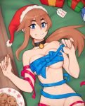  1girl artist_name bare_shoulders bell bell_collar black_collar blue_eyes blue_ribbon blush box breasts brown_hair chocolate christmas collar collarbone commentary commission cookie english_commentary food gift gift_box hair_between_eyes hat highres large_breasts long_hair looking_at_viewer lying merry_christmas naked_ribbon navel on_back original ponytail red_ribbon ribbon rob_ishi santa_hat smile solo twitter_username 