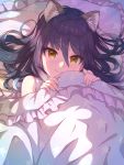  1girl animal_ear_fluff animal_ears bed_sheet eyebrows_visible_through_hair frilled_pillow frills highres kei_ne light_blush long_hair pillow princess_connect! princess_connect!_re:dive purple_hair shiori_(princess_connect!) smile solo star_(symbol) star_print tsurime yellow_eyes 