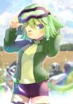  1girl animal_ears arms_up bangs black_legwear black_shorts blurry blurry_background blush cat_ears cat_girl cat_tail commentary_request depth_of_field eyebrows_visible_through_hair goggles goggles_on_head green_eyes green_hair green_jacket green_sweater grin hair_between_eyes jacket kouu_hiyoyo long_sleeves looking_at_viewer one_eye_closed open_clothes open_jacket original puffy_long_sleeves puffy_sleeves short_shorts shorts smile solo sweater tail thighhighs 