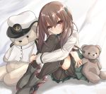  1girl bike_shorts black_legwear black_shorts brown_eyes brown_hair commentary_request green_skirt headband headgear kantai_collection kasashi_(kasasi008) looking_at_viewer pleated_skirt shorts skirt smile stuffed_animal stuffed_toy taihou_(kantai_collection) teddy_bear thighhighs 