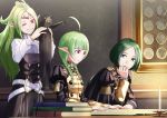  1boy 2girls alternate_costume book candle cat fire_emblem fire_emblem:_three_houses fire_emblem_awakening garreg_mach_monastery_uniform green_hair hand_on_own_chin highres linhardt_von_hevring longcat manakete mother_and_daughter multiple_girls nah_(fire_emblem) nowi_(fire_emblem) reading sitting sukkirito_(rangusan) table tiara upper_body 