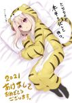  1girl 2021 animal_costume animal_ears animal_print bangs black_legwear blonde_hair commentary_request fake_animal_ears fake_tail fate/stay_night fate_(series) full_body highres hood hood_up illyasviel_von_einzbern long_hair long_legs long_sleeves looking_at_viewer lying on_side open_mouth pink_eyes sen_(astronomy) sleeves_past_wrists solo tail tiger_costume tiger_ears tiger_print tiger_tail translation_request v-shaped_eyebrows 