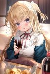  1girl bed blonde_hair blue_eyes blurry blurry_background blush bottle chips cola cup curtains food frilled_shirt frills highres holding holding_cup indoors jacket jacket_on_shoulders kanda_done kotatsu long_hair long_sleeves looking_at_viewer open_mouth original shirt sitting soda soda_bottle solo table twintails white_shirt 