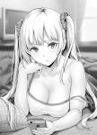  1girl bangs bare_shoulders blurry blurry_background blush breasts cellphone character_request cleavage collarbone commentary_request copyright_request depth_of_field elbow_rest gentsuki greyscale hair_ornament hair_scrunchie hand_on_own_chin highres holding holding_phone kotatsu large_breasts long_hair looking_at_viewer lying monochrome on_stomach phone pillow plaid scrunchie solo spaghetti_strap strap_slip table twintails 