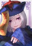  1boy aibon akudama_drive blue_headwear chinese_clothes cutthroat_(akudama_drive) hat highres jiangshi looking_at_viewer male_focus mole mole_under_eye ofuda purple_eyes qing_guanmao smile solo tongue tongue_out upper_body white_hair wide_sleeves 