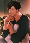  1boy adam&#039;s_apple alternate_costume bangs black_hair black_shirt casual contemporary couch finger_to_mouth grey_eyes haikyuu!! highres kuro_(tsumito) kuroo_tetsurou light lips long_sleeves looking_to_the_side male_focus pillow plant shirt short_hair sitting solo spiked_hair upper_body v-neck 