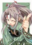  1girl commentary_request cowboy_shot green_hakama grey_hair hachimaki hakama hakama_pants headband high_ponytail highres index_finger_raised japanese_clothes kantai_collection long_hair looking_at_viewer muneate one_eye_closed ponytail solo yashin_(yasinz) zuihou_(kantai_collection) 