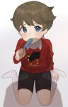  1boy bangs black_shorts blue_eyes blush brown_hair collared_shirt commentary_request eating food gen_8_pokemon greedent hand_on_own_leg highres holding holding_stick ijipon looking_at_viewer looking_up male_focus pokemon pokemon_(game) pokemon_swsh popsicle print_sweater red_sweater shirt short_hair shorts sitting socks solo stick sweater white_legwear white_shirt youngster_(pokemon) 