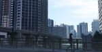  1girl black_hair black_legwear bridge building city cityscape cloud commentary glasses highres monorail morning original pantyhose railing real_world_location river scenery school_uniform sign skirt sky solo tokyo_(city) tree unagi189 walking 