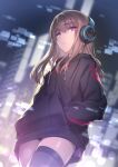  1girl bangs black_legwear blurry blurry_background brown_hair closed_mouth dutch_angle eyebrows_visible_through_hair hands_in_pockets headphones highres hisasi long_hair looking_at_viewer original pink_eyes solo thighhighs 
