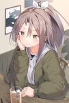  1girl abyssal_ship alternate_costume bangs blush brown_eyes chair cup drinking_straw enemy_aircraft_(kantai_collection) eyebrows_visible_through_hair green_jacket hair_between_eyes hair_ribbon head_rest hood hood_down hoodie ice ice_cube jacket kantai_collection light_brown_hair long_hair long_sleeves natsuki_(gedo) ponytail ribbon sitting smile solo table white_jacket zuihou_(kantai_collection) 