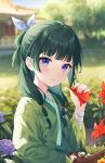  1girl blurry blurry_background commentary day depth_of_field flower freckles green_hair green_hanfu hand_up highres hitsukuya holding holding_flower kusuriya_no_hitorigoto long_hair long_sleeves looking_at_viewer maomao_(kusuriya_no_hitorigoto) outdoors purple_eyes red_flower solo 