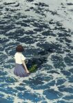  1girl bob_cut brown_hair from_above from_behind highres hiko_(scape) holding leaf ocean original pleated_skirt school_uniform shadow shirt short_hair skirt solo wading water waves white_shirt wind 