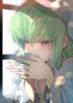  1girl blanket c.c. code_geass creayus cup drinking eyebrows_visible_through_hair green_hair lens_flare mug sunlight sweat sweatdrop window yellow_eyes 