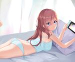  1girl ass bangs bed bed_sheet blue_camisole blue_eyes blue_panties breasts camisole controller curtains feet_up go-toubun_no_hanayome hair_between_eyes highres holding holding_controller light_blush light_particles long_hair looking_at_viewer looking_back lying medium_breasts nakano_miku nintendo_switch on_bed on_stomach panties pillow red_hair side-tie_panties sleeveless smile solo strap_slip thighs tiara_(871220) underwear 