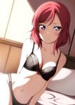  1girl arm_behind_back bangs bare_shoulders black_bra black_panties bra breasts closed_mouth collarbone commentary day eyebrows_visible_through_hair highres indoors looking_at_viewer love_live! love_live!_school_idol_project medium_hair navel nishikino_maki on_bed panties pillow purple_eyes red_hair reno_0901 shadow solo sunlight swept_bangs underwear underwear_only 