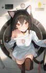  1girl animal_collar animal_ear_fluff animal_ears bell black_hair black_thighhighs blush buckle cat_ears cat_girl cat_tail closed_mouth collar collarbone double-parted_bangs e_name foot_out_of_frame foot_up hair_between_eyes highres long_hair long_shirt long_sleeves looking_at_viewer neck_bell no_pants off-shoulder_shirt off_shoulder original print_shirt red_eyes shirt solo standing straight-on straight_hair tail thighhighs unworn_clothes washing_machine white_shirt 