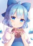  1girl ahoge blue_bow blue_dress blue_eyes blue_hair blue_wings blurry blurry_background blush bow box cirno closed_mouth collared_shirt commentary_request depth_of_field detached_wings dress food food_on_face frilled_shirt_collar frills gift gift_box hair_bow hands_up heart-shaped_box holding holding_gift ice ice_wings pjrmhm_coa puffy_short_sleeves puffy_sleeves shirt short_hair short_sleeves solo touhou white_shirt wings 