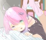  1girl ahoge black_shirt blush candy_hair_ornament ebichoco_pasta food_themed_hair_ornament green_eyes hair_ornament heterochromia highres himemori_luna hololive long_hair looking_at_viewer loose_clothes loose_shirt loose_socks lying off_shoulder on_bed on_stomach pink_eyes purple_eyes shirt solo virtual_youtuber waking_up 