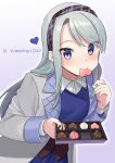  1girl akagi_kurage blue_dress blue_eyes blush candy chocolate chocolate_heart closed_mouth coat dress eyebrows_visible_through_hair food gradient gradient_background grey_coat heart highres holding kantai_collection long_hair long_sleeves mouth_hold sagiri_(kancolle) silver_hair smile solo valentine 