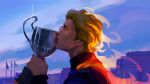  1boy alternate_universe blonde_hair blue_racing_suit blue_sky building closed_eyes commentary crossover english_commentary fantastic_four fire flag formula_one holding holding_trophy johnny_storm kissing_object male_focus marvel pyrokinesis racing_suit short_hair sky solo trophy underscorecip 