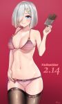  1girl absurdres artist_name bikini black_legwear blue_eyes breasts candy chocolate chocolate_bar commentary_request cowboy_shot dated food gradient gradient_background hair_ornament hair_over_one_eye hairclip hamakaze_(kancolle) highres kantai_collection large_breasts onion_(kumagaioyr) pink_bikini red_background short_hair silver_hair smile solo standing striped striped_bikini swimsuit thighhighs valentine 
