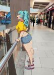  1girl aqua_hair blue_shorts breasts denim denim_shorts escalator hatsune_miku indoors jersey jk_arts large_breasts long_hair mall open_mouth photo_background shirt shoes short_shorts shorts solo standing twintails vocaloid white_shoes yellow_shirt 